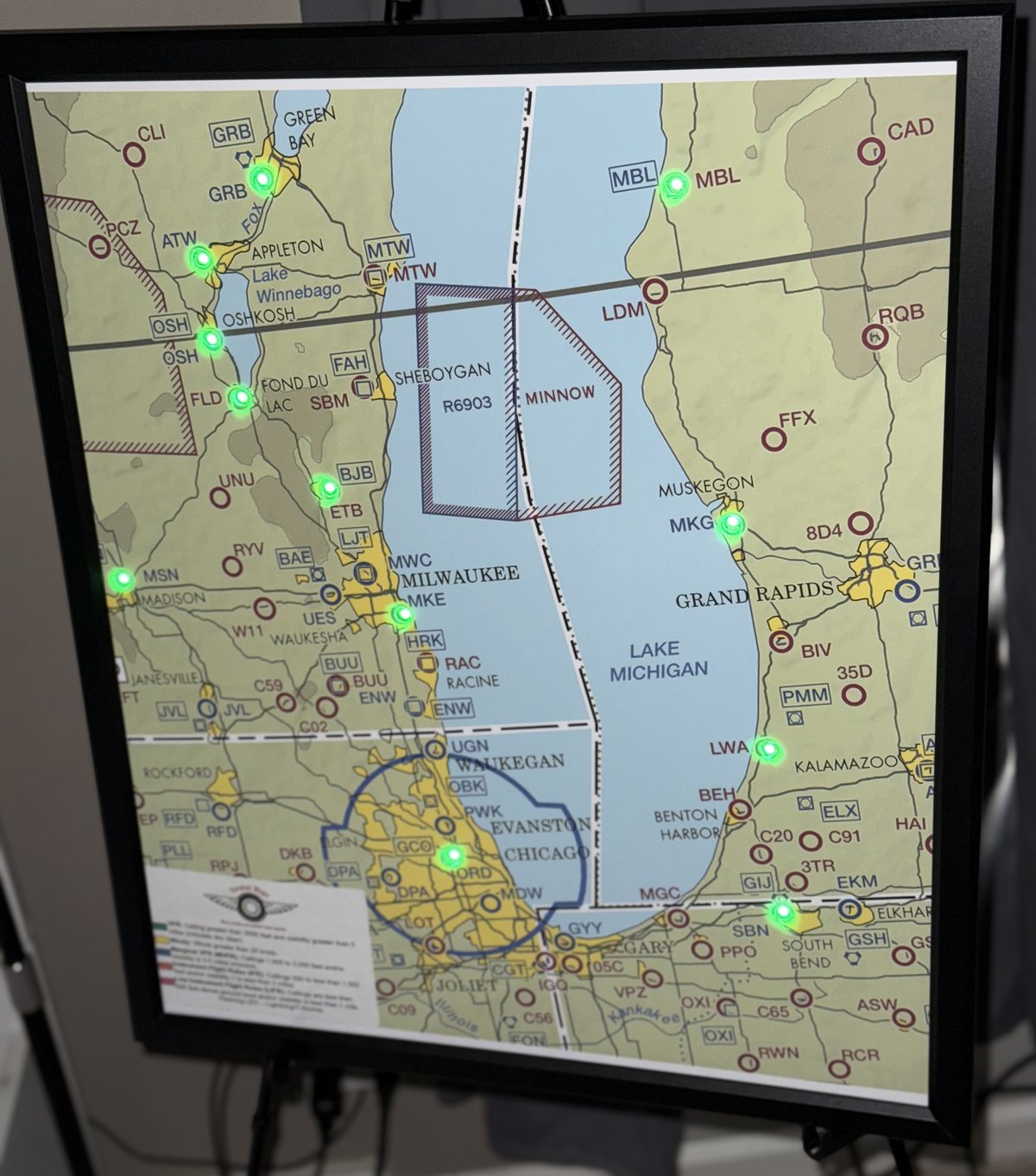 Framed LED METAR map of the Great Lakes region showing VFR green conditions
