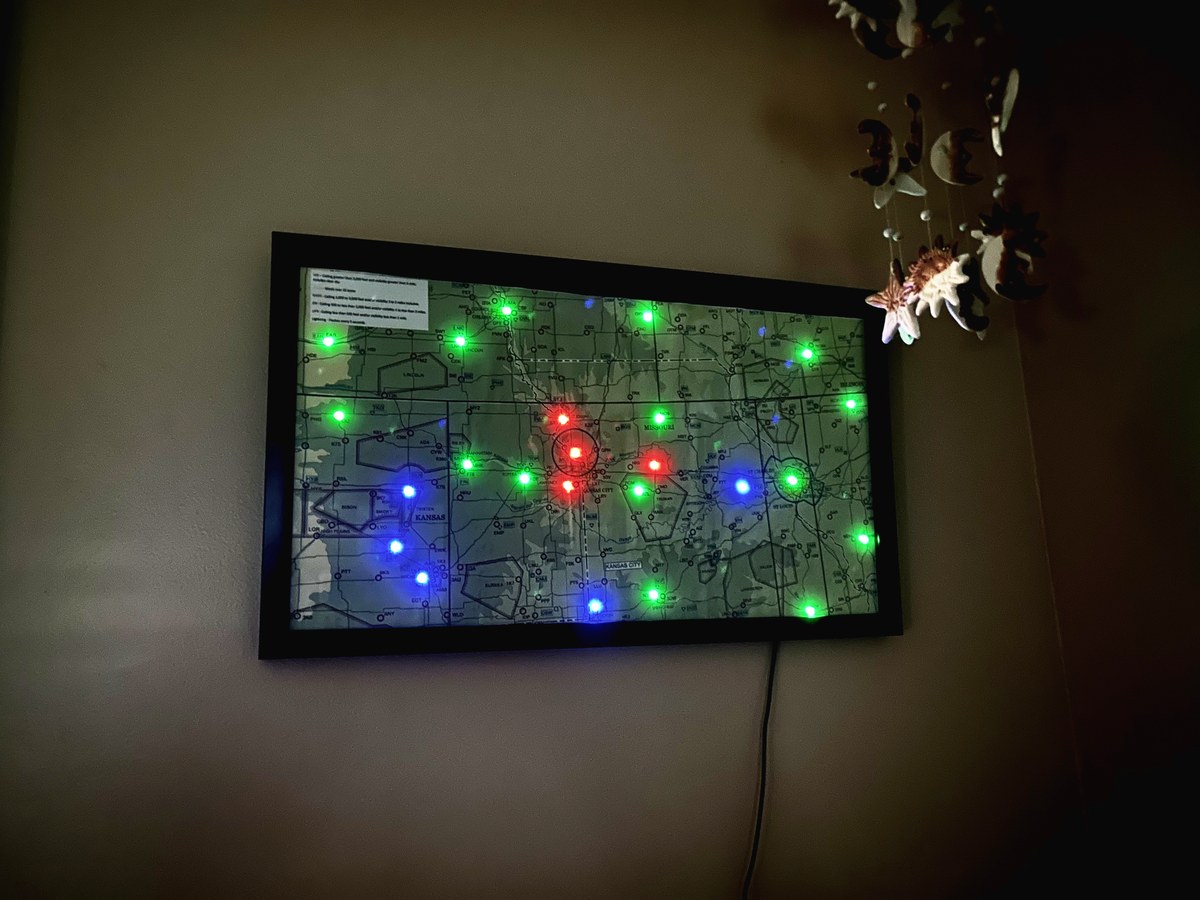 Large framed Hotshot Map on a wall showing mixed VFR, MVFR, and IFR conditions across Kansas City region