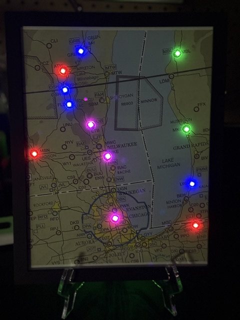 LED METAR map of the Lake Michigan region glowing at night, Milwaukee to Chicago